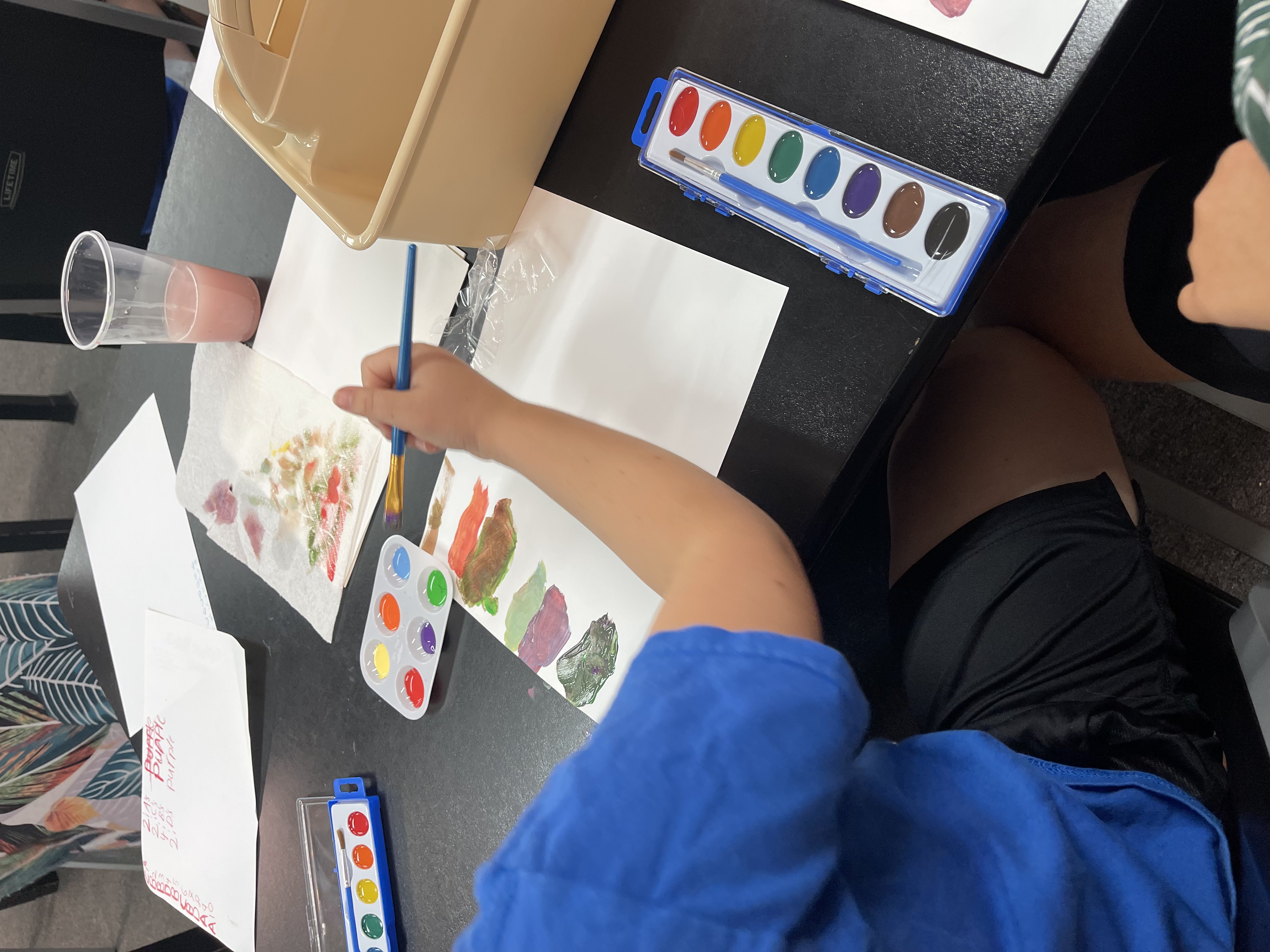 Student creating artwork during Created to Create Jax class